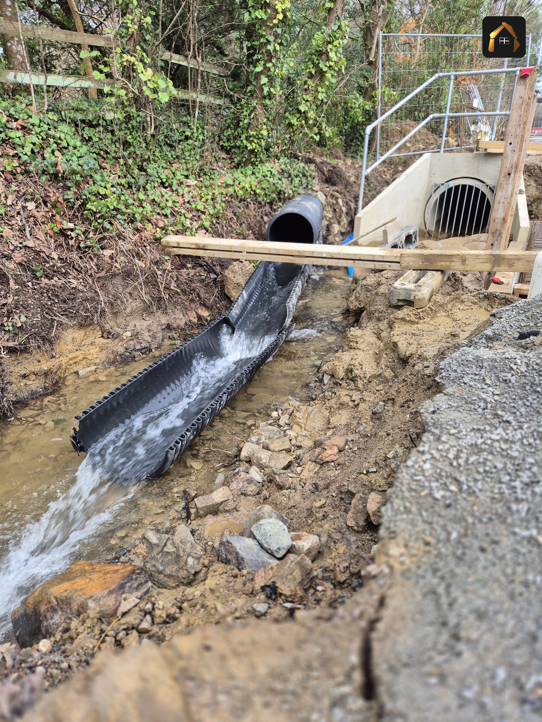 Completed culvert headwall with water running from the outfall on the A30 bypass in Penzance