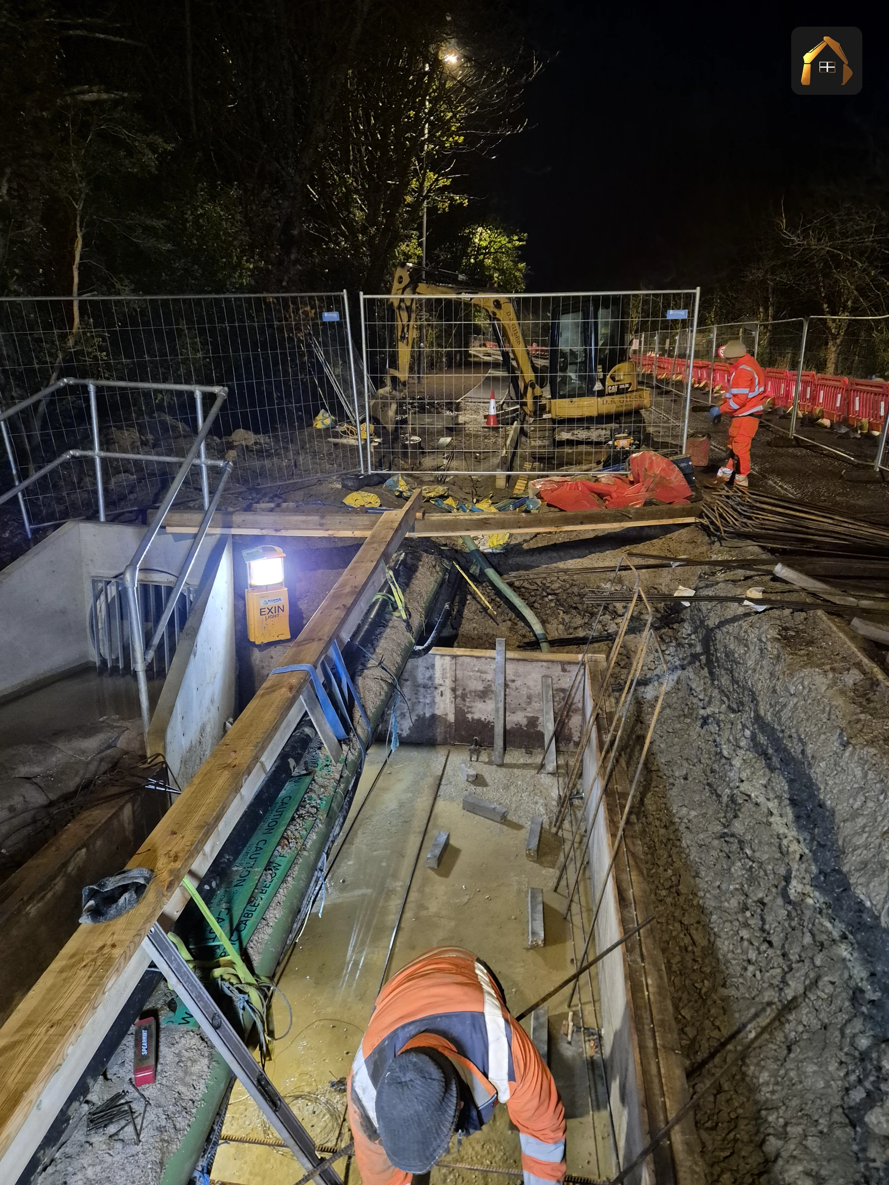 Night working under floodlights on the A30 bypass retaining wall in Penzance