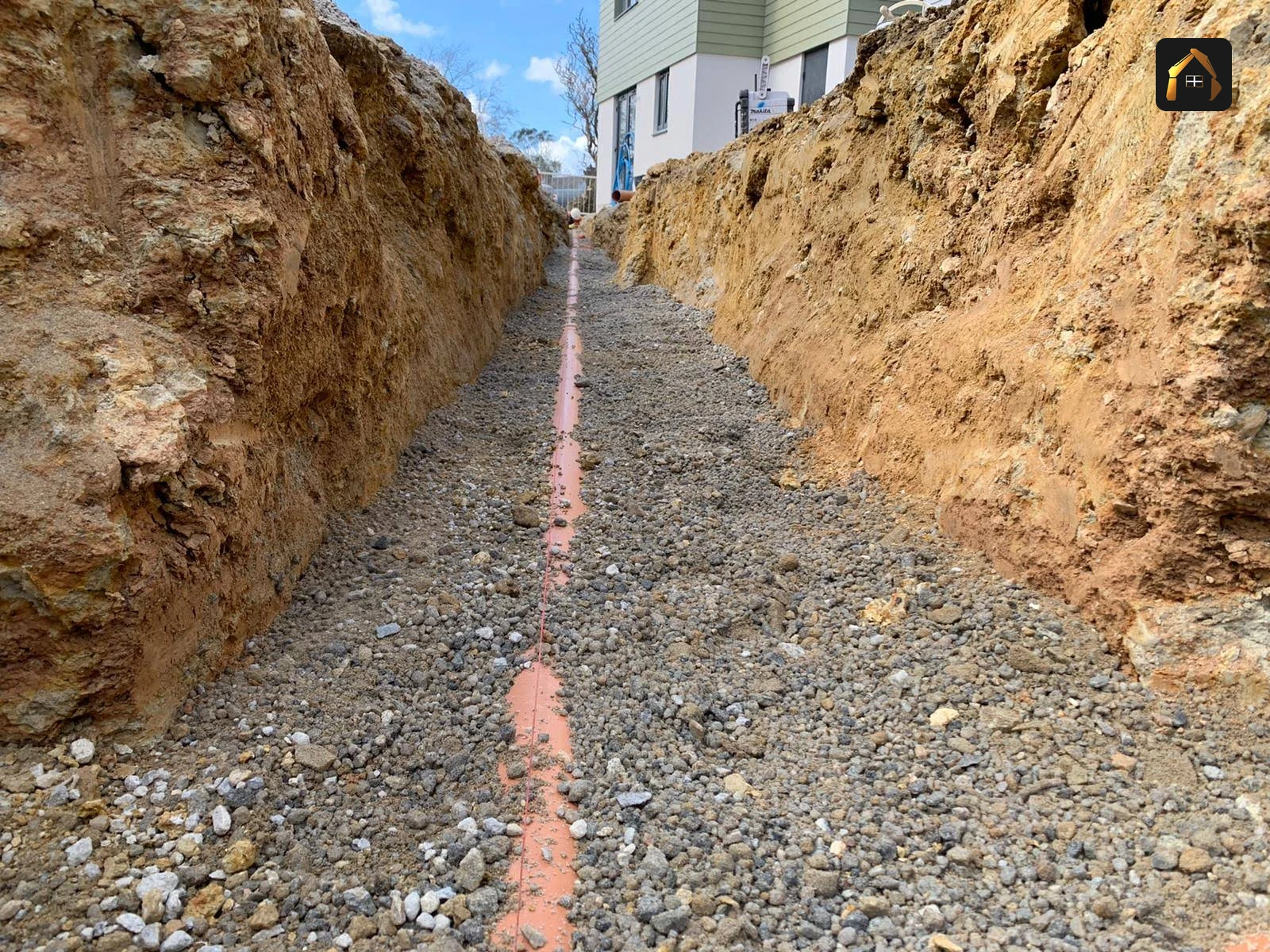 Deep drainage trench running the full length of the plot at Goonhavern