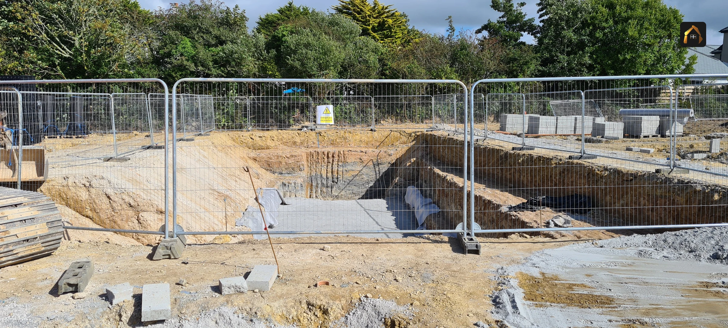Excavator working an attenuation excavation in Goonhavern