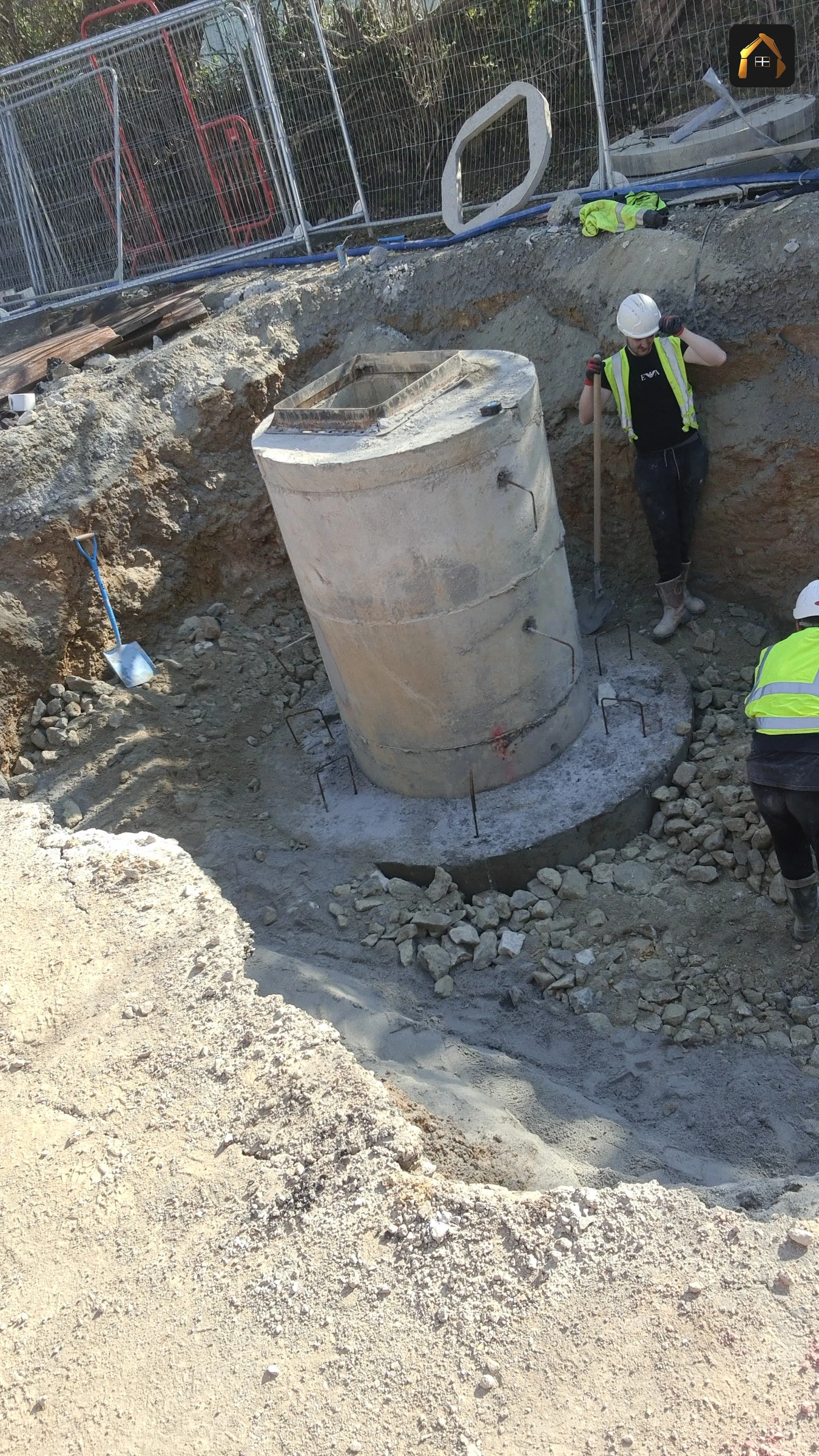 Precast concrete manhole chamber ring being set into position at Goonhavern