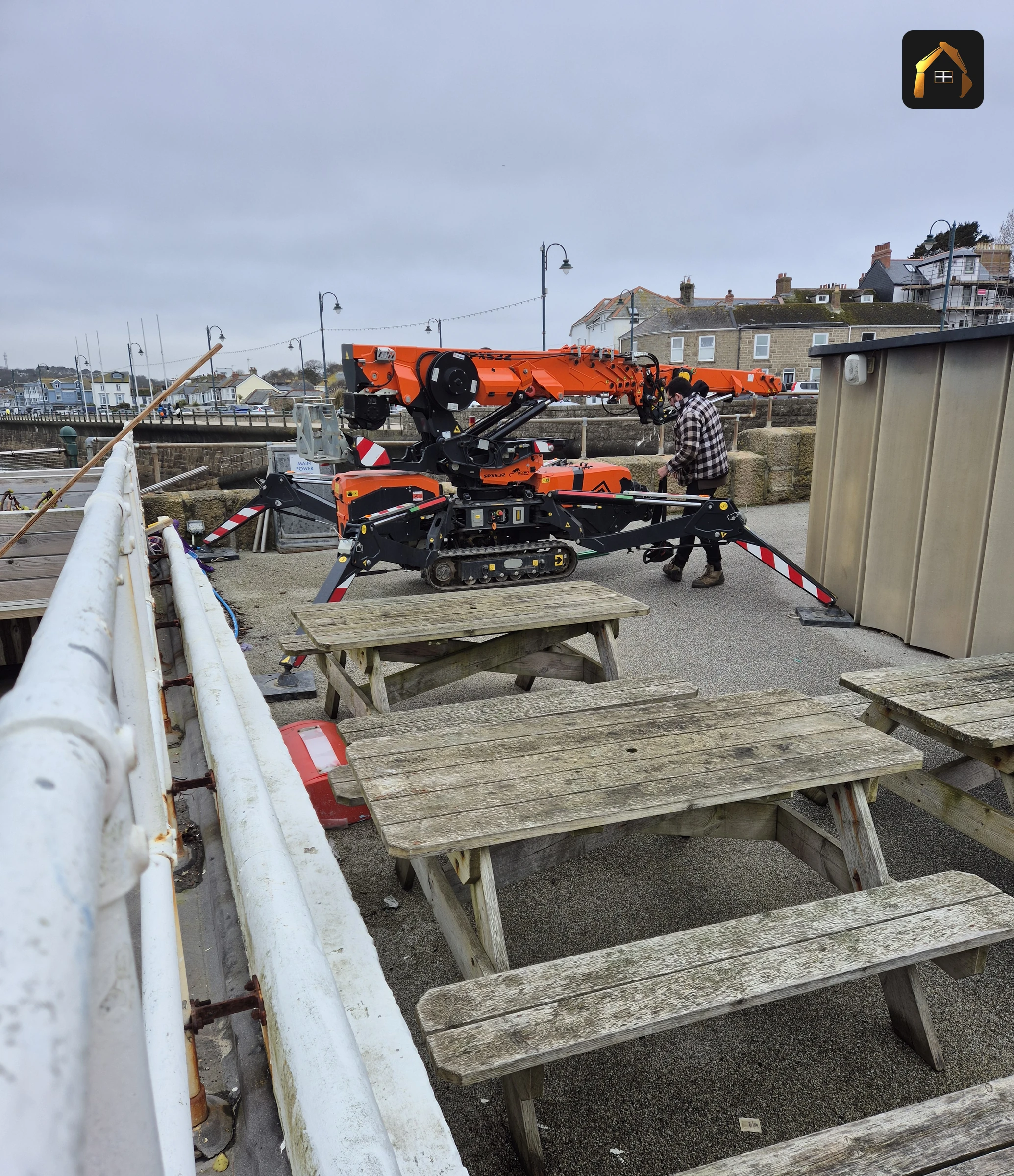 Spider crane set up on the Jubilee Pool sea wall in Penzance