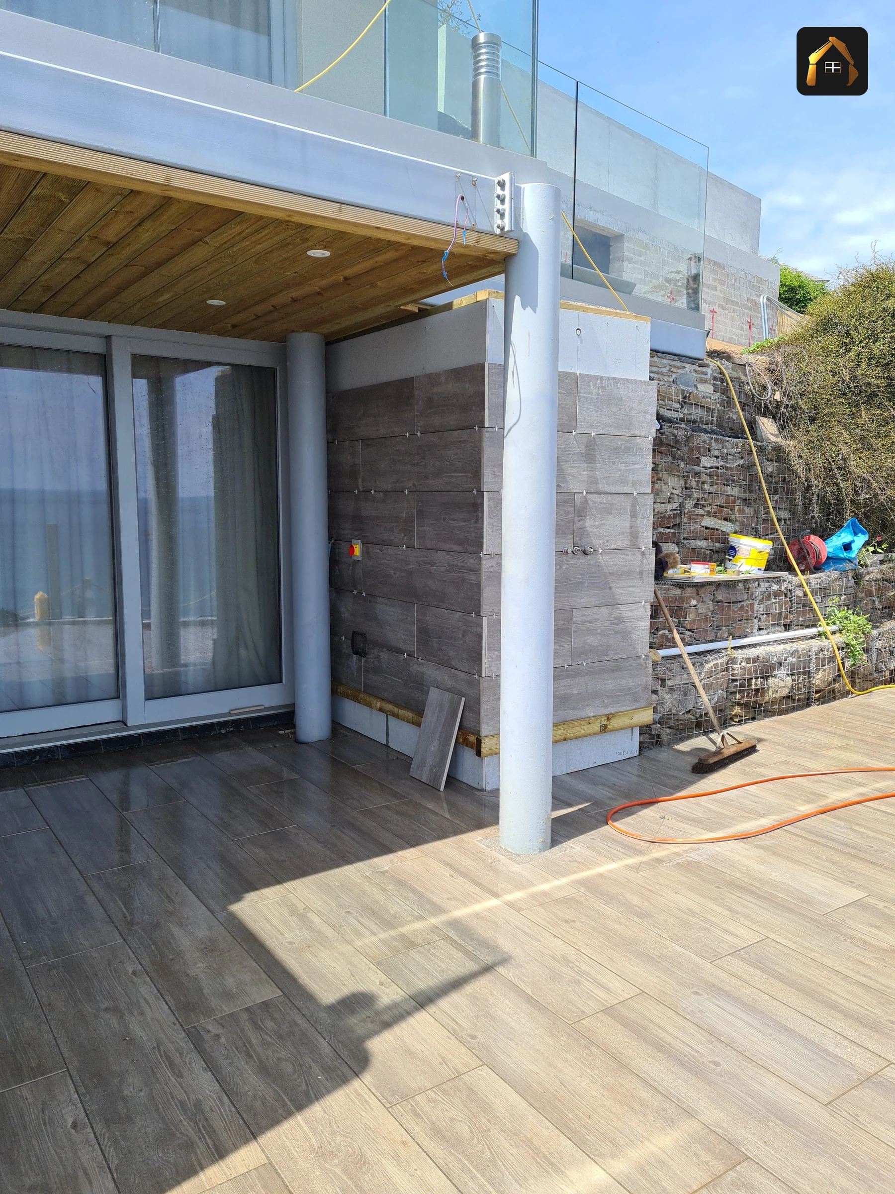 Completed contemporary glazed clifftop house with a timber soffit and sea view in Looe