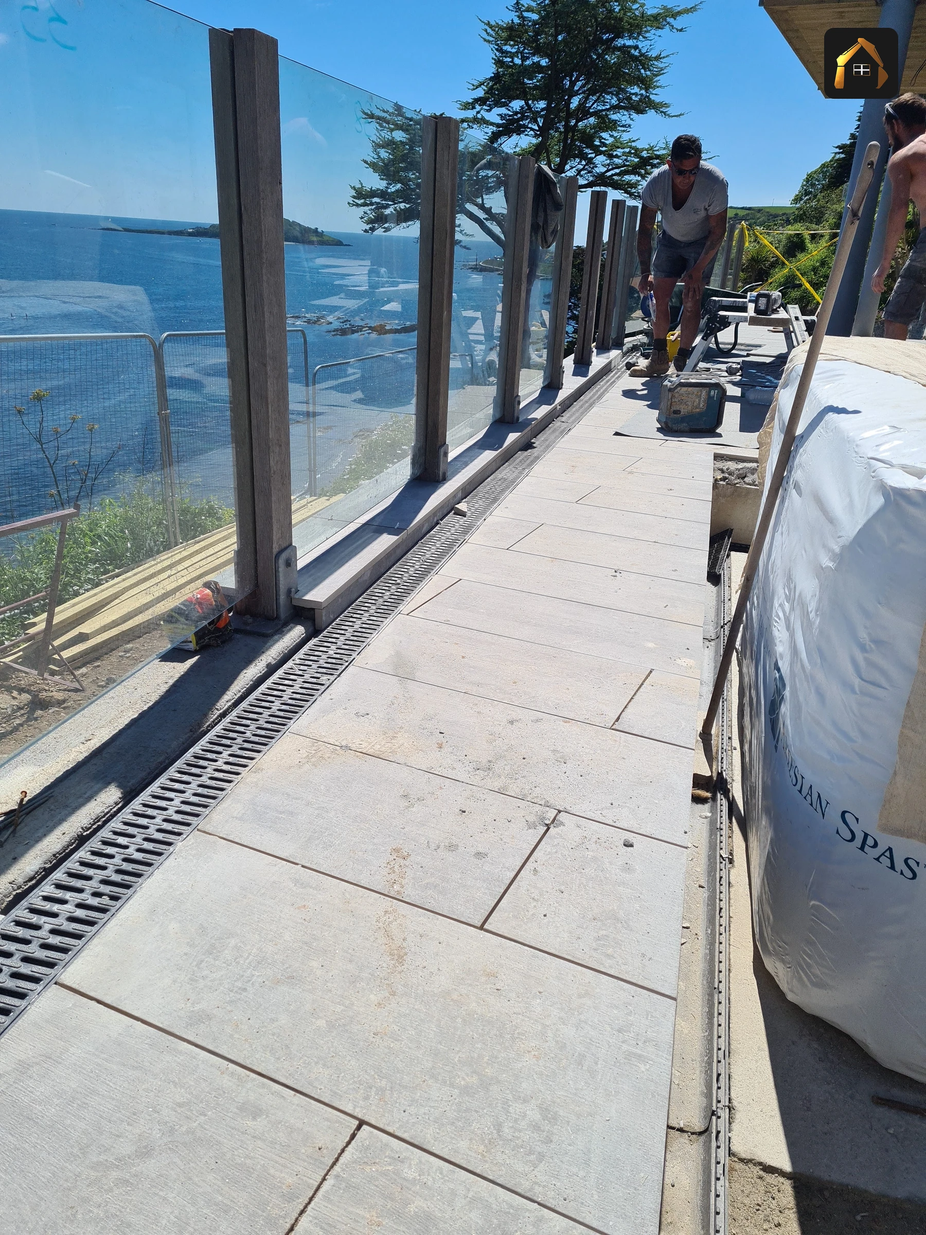 Completed paved walkway curving along the cliff edge in Looe