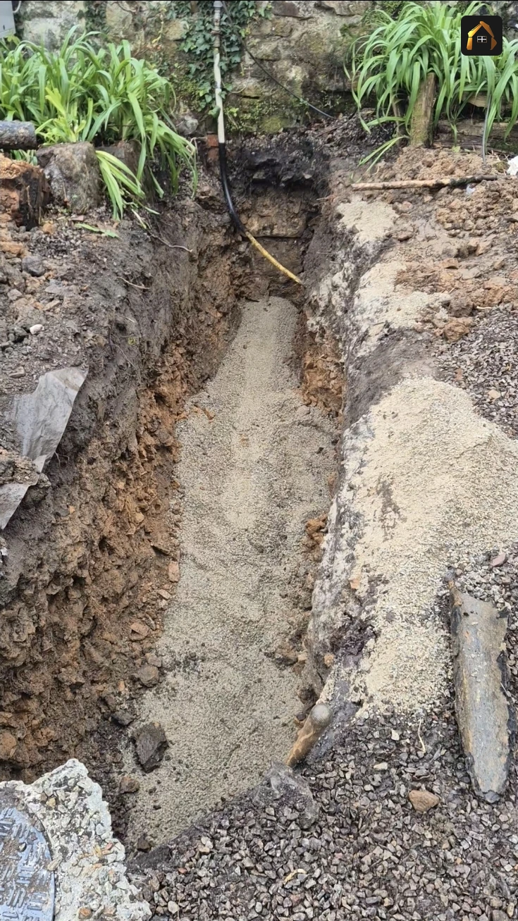 Open trench showing the new sewer connection run in Ludgvan