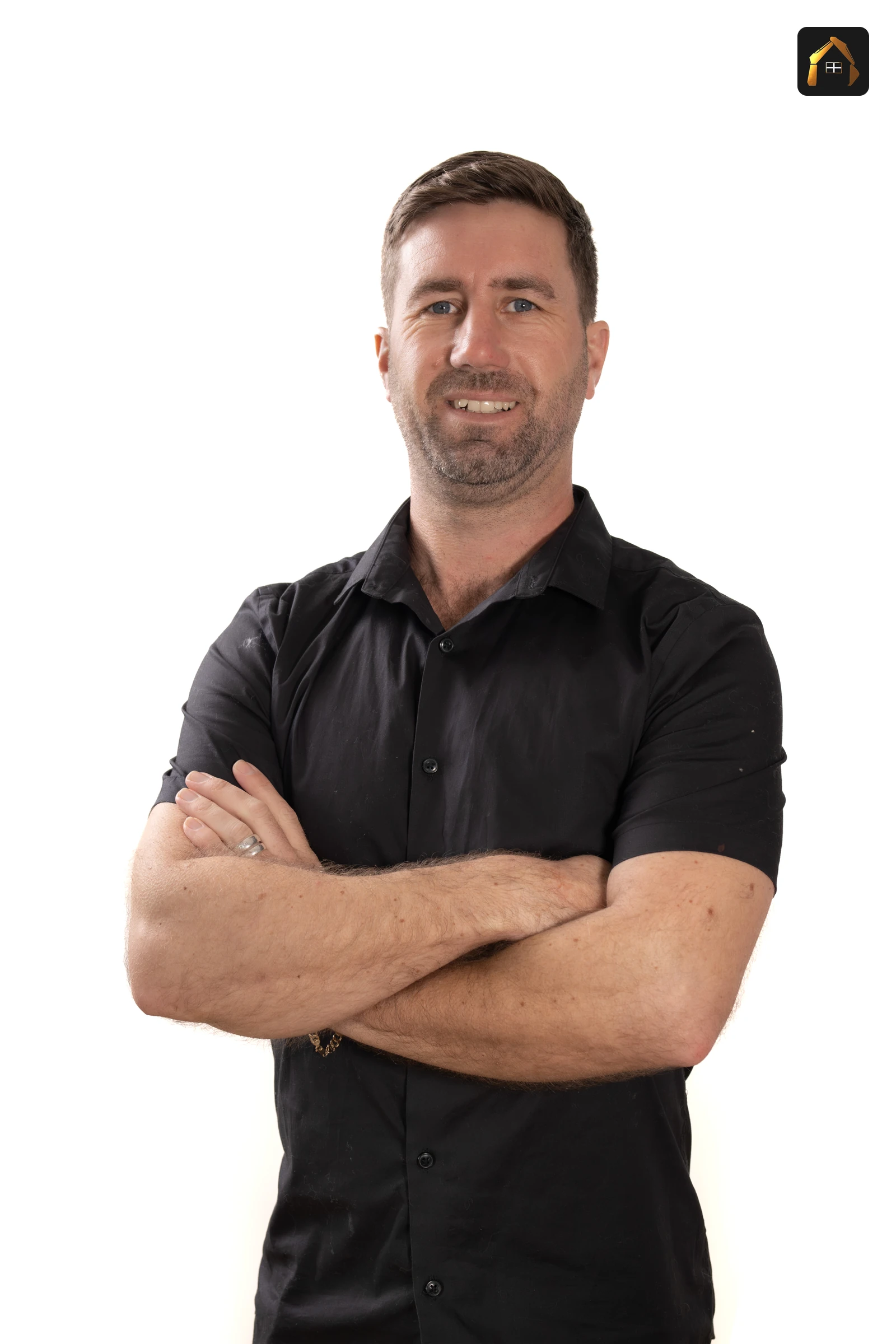 Matt Richards of Cornwall Civils & Construction in a black shirt with arms folded