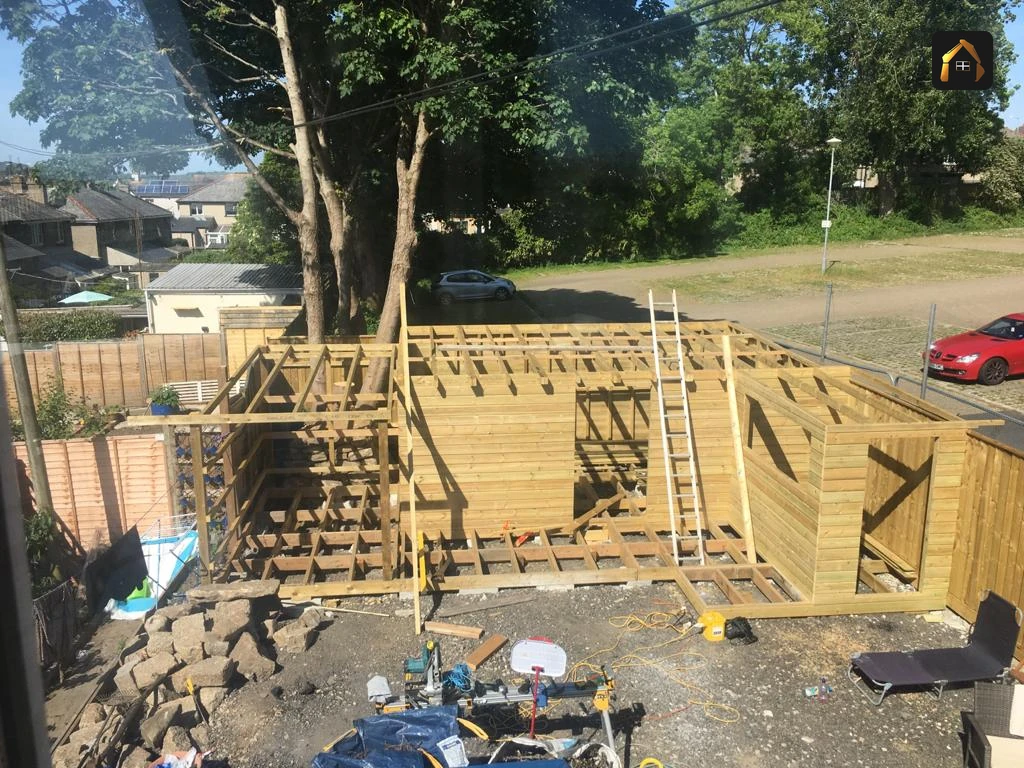 Elevated view of the timber frame and deck for a garden building in Penzance