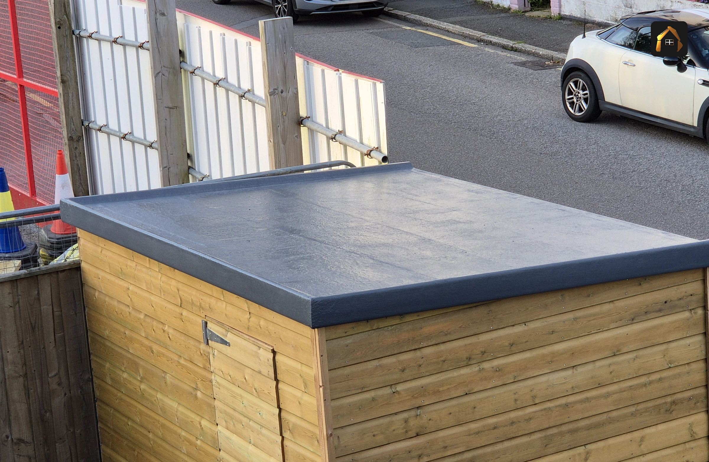 Completed garden building with a grey flat roof, seen from above, in Penzance