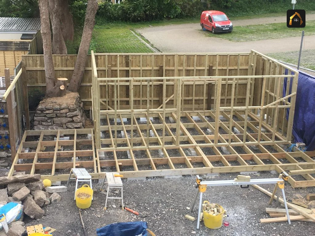 Timber frame walls going up on a raised deck for a garden building in Penzance