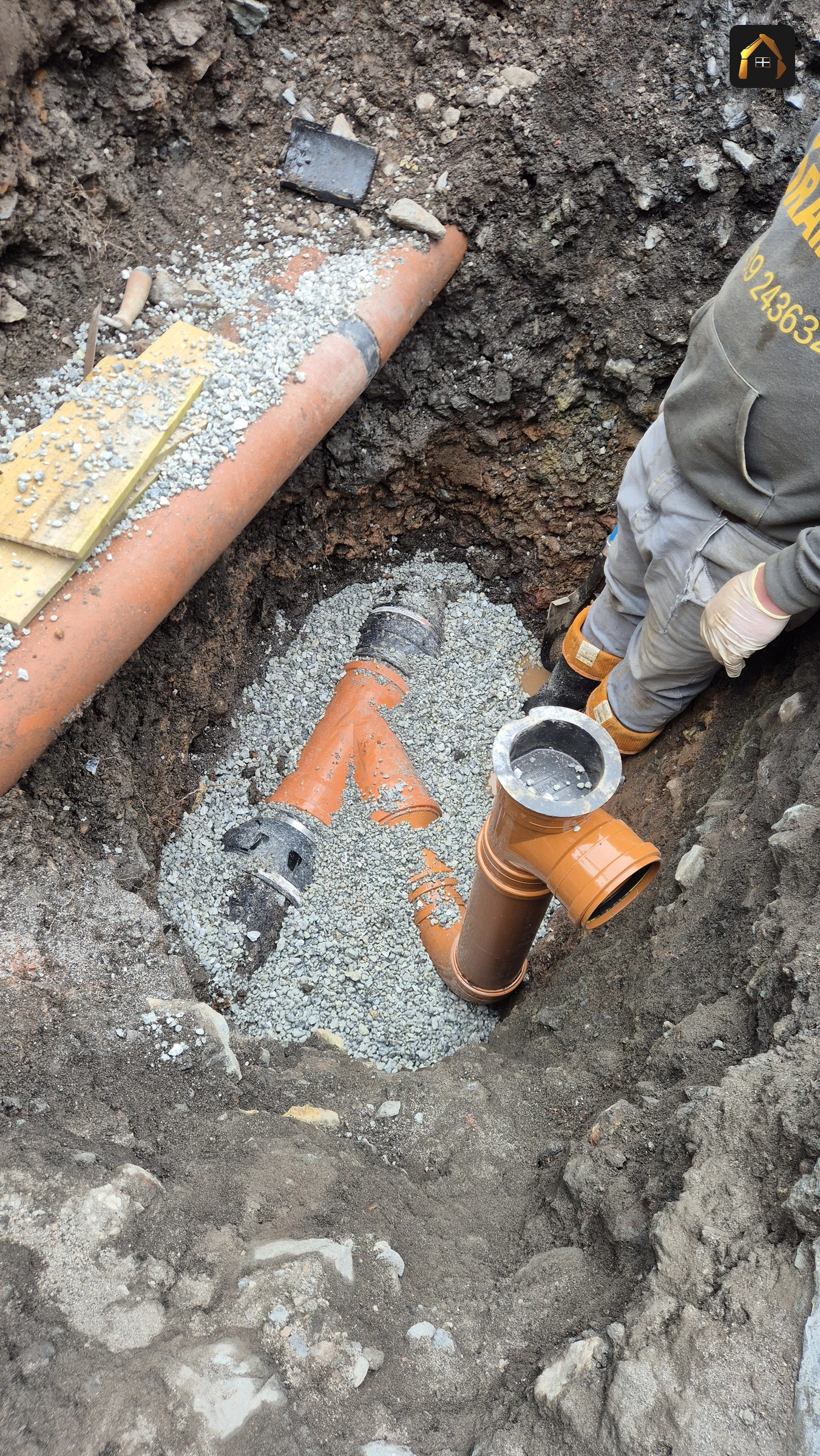 New drainage junction being connected in an open trench in St Agnes