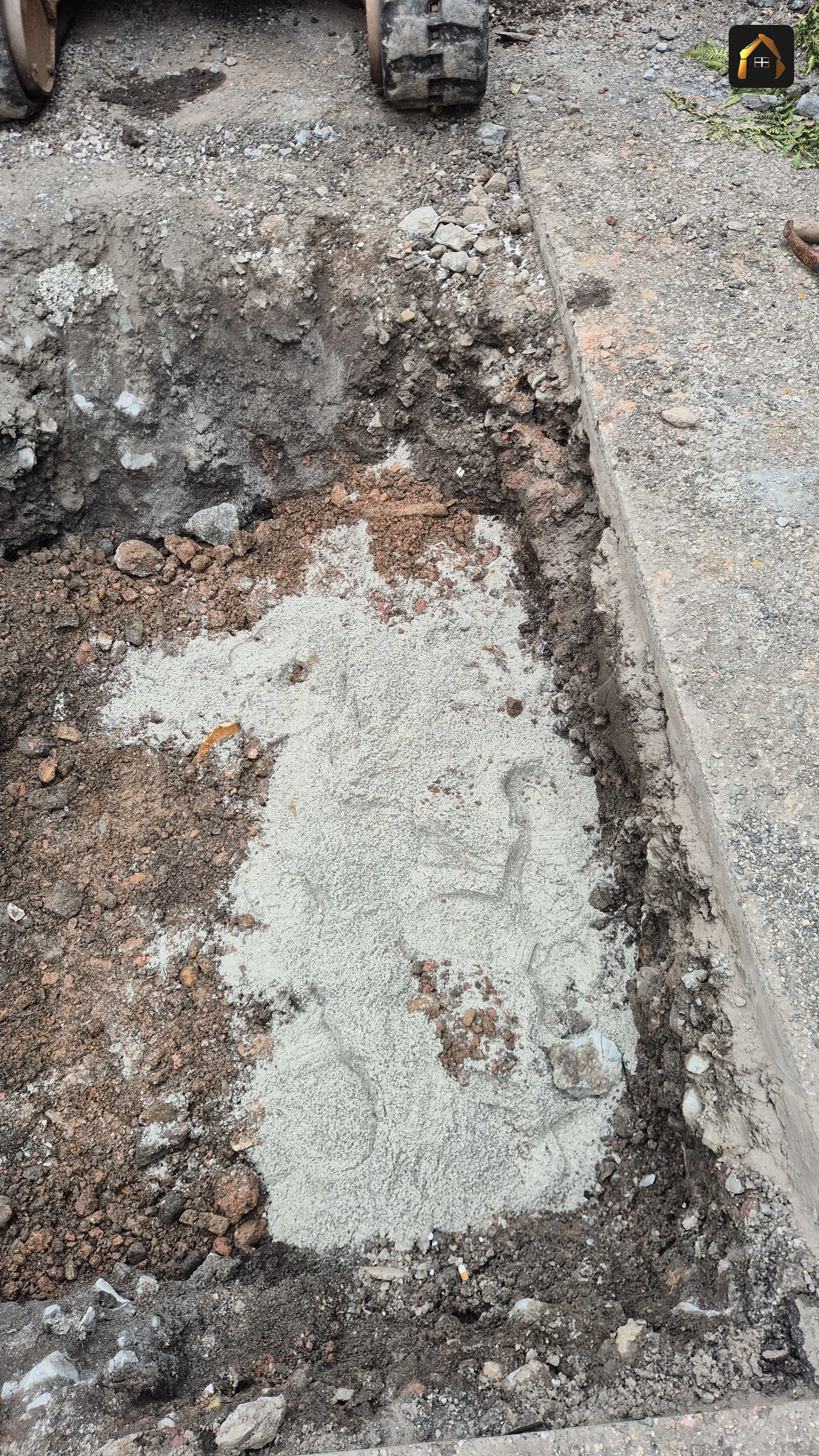 Completed trench backfilled and concreted flush with the tarmac in St Agnes