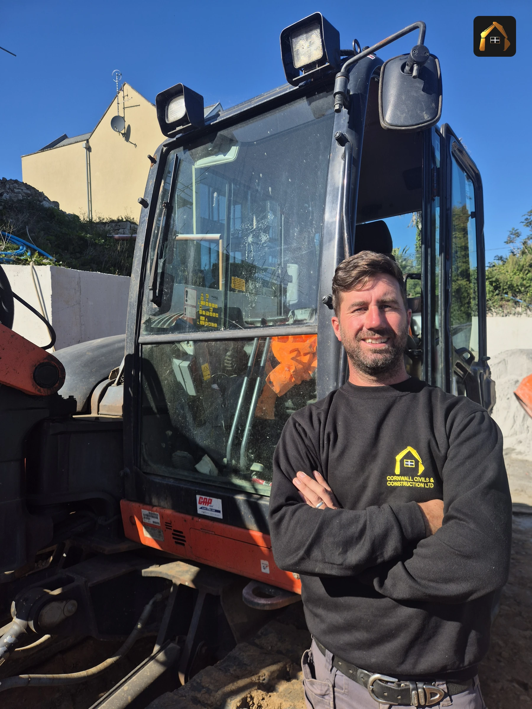 Matt Richards of Cornwall Civils & Construction in an excavator cab at Carrick Lodge in St Ives