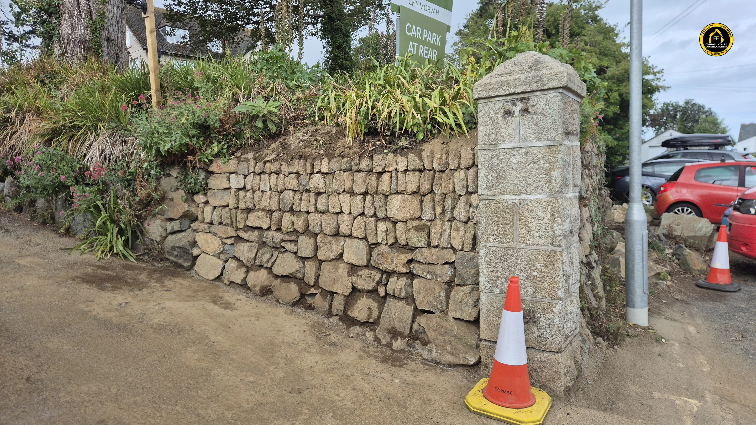 Completed Cornish hedge running between two granite piers in St Ives