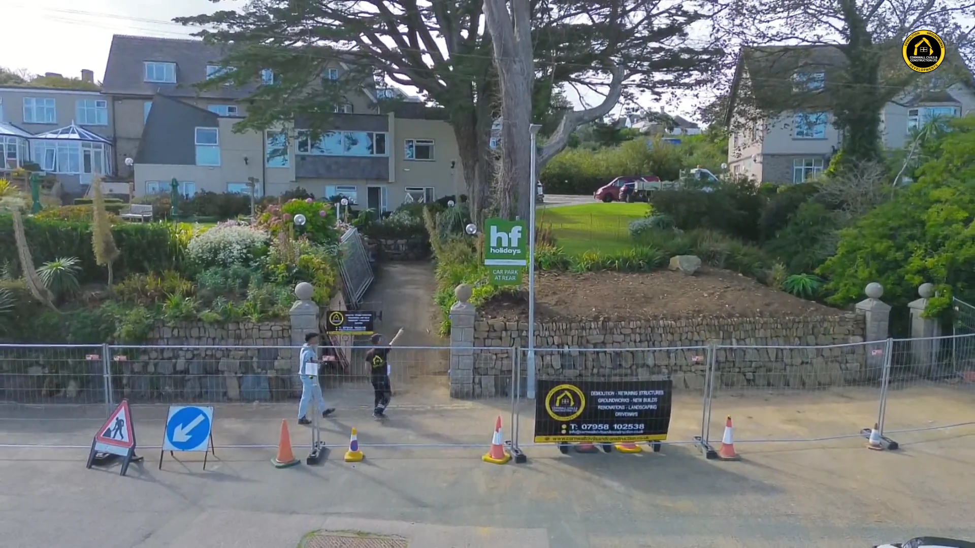 Granite gate piers either side of the fenced Cornish hedge site in St Ives