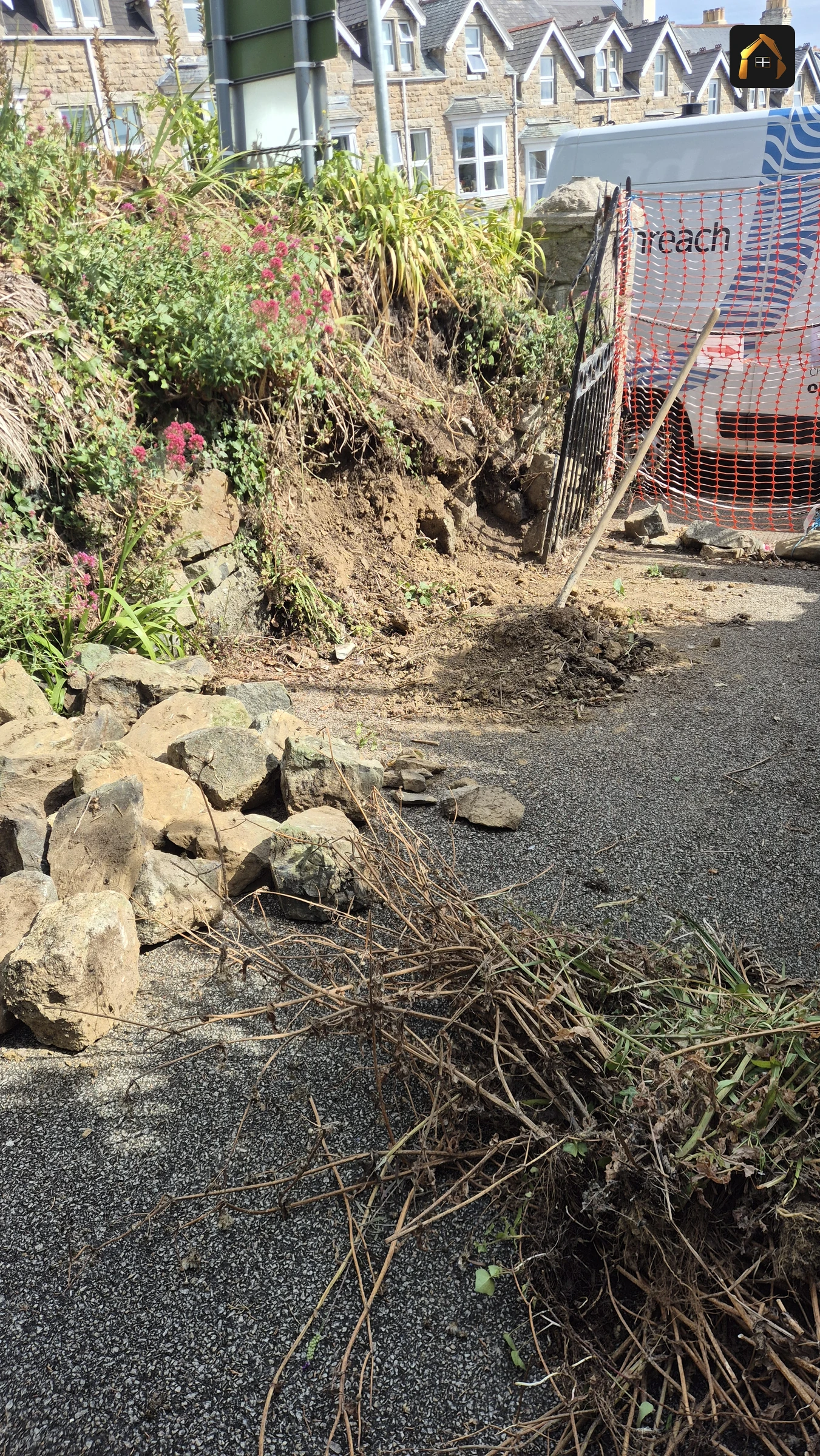 Before work: roadside bank stripped back to bare earth in St Ives